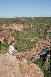 Custom Safaris - Pafuri Walking Trails - Guests relaxing on a rock
