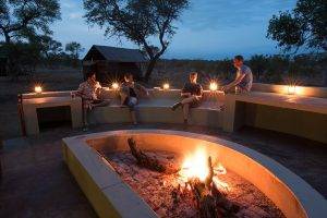 Wild Africa 2 Buffelshoek Tented Camp - Evening boma fire with 4 people sat around fire