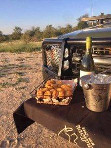 Indlovu River Lodge - A bottle champagne on a game vehicle