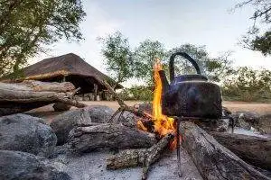 Pungwe Bush Camp 1 Pungwe Camp fire with kettle boiling - Pungwe Bush Camp Photo Safari