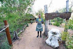 Pungwe staff lady holding tray with drink on a tray.