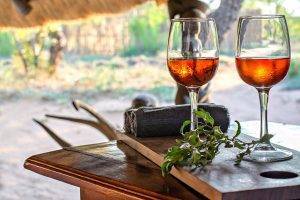 Pungwe Tented Bush Camp - Drinks showing two glasses of pink wine